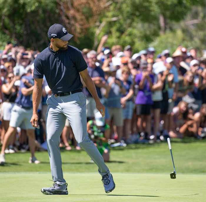 Stephen Curry celebrates on the golf course.